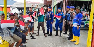 Semarak HUT RI ke-80, Ditpolairud Polda Kaltim Gelar Aksi Pembagian Bendera Merah Putih